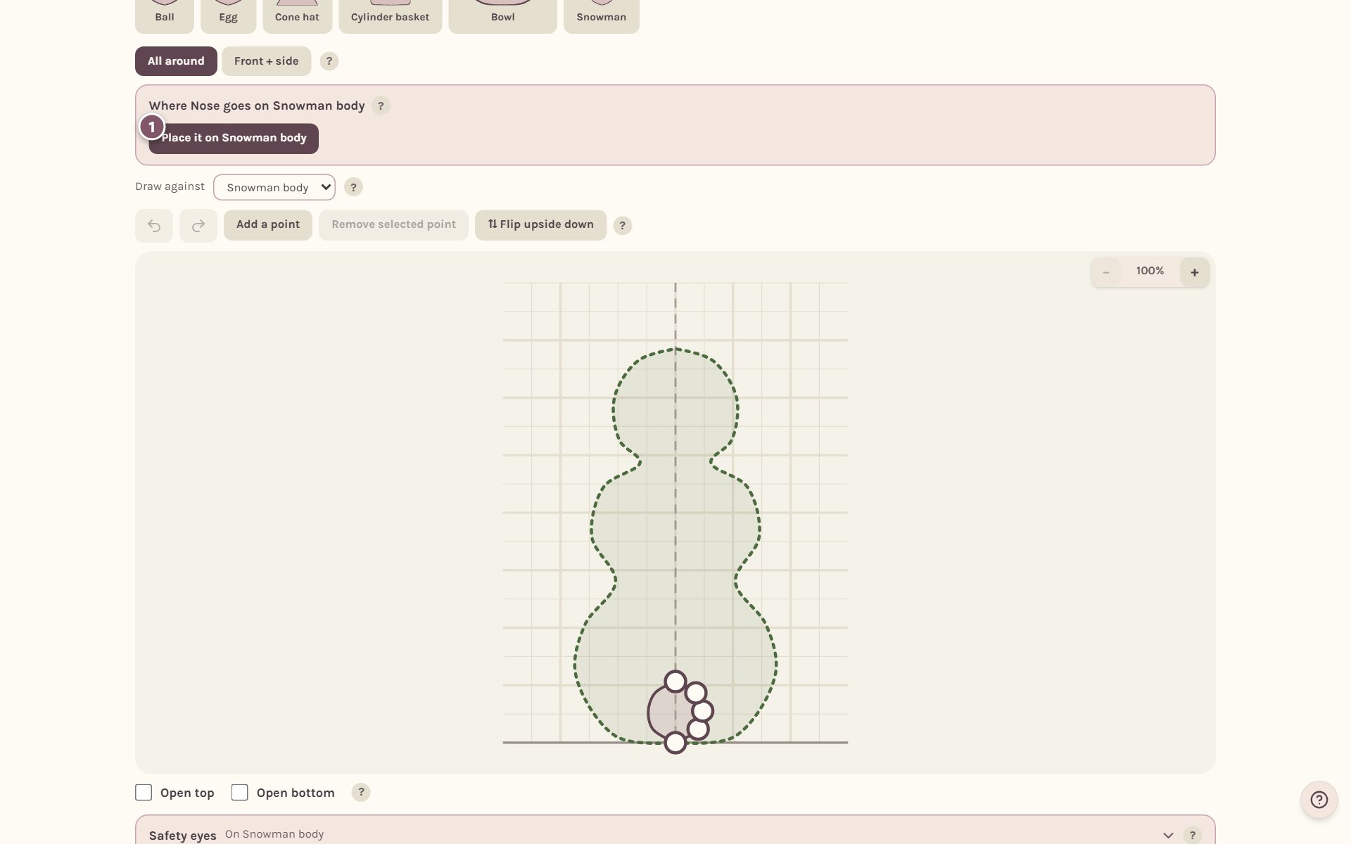 The card for placing the nose on the snowman body, with the place button marked 1 (on a computer)