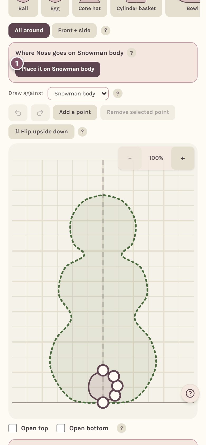 The card for placing the nose on the snowman body, with the place button marked 1 (on a phone)